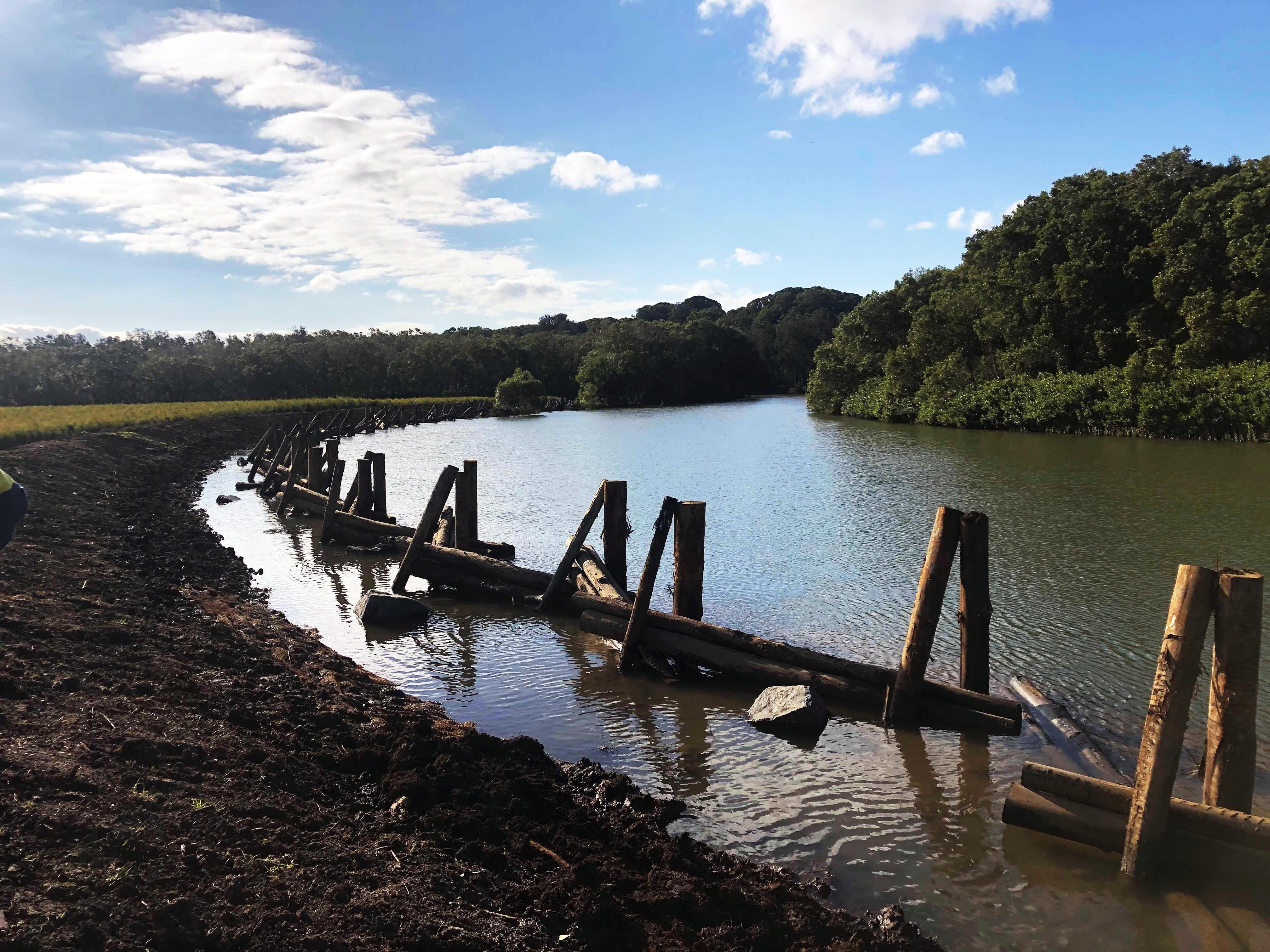 River with wooden bank stabilisation works.