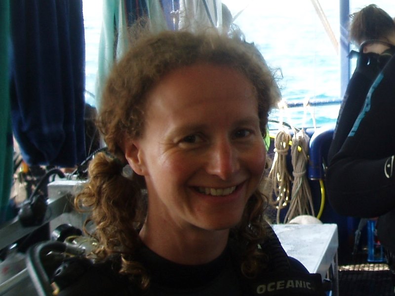 Victoria in wetsuit on a boat.